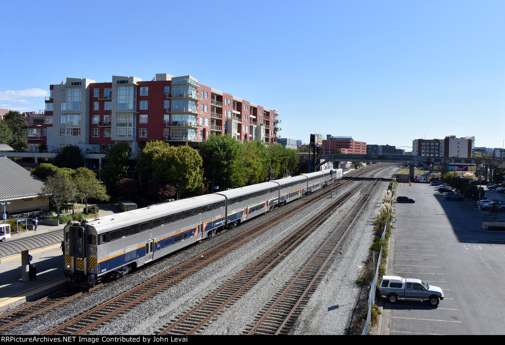  Amtrak Capitol Corridor Train # 534, enroute from Oakland Jack London Square to Sacramento, arrives at Emeryville Station with California Cab Car # 8312 in the lead